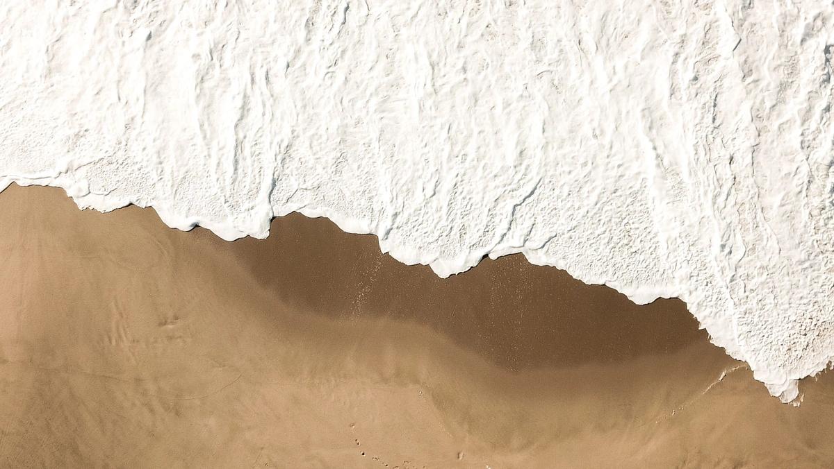 white surf on sand