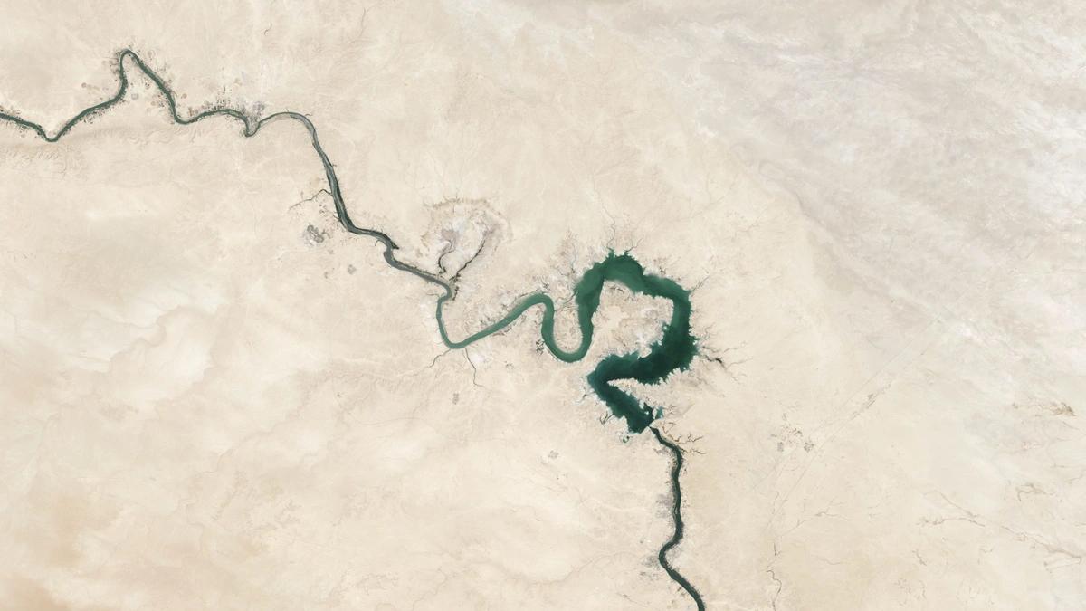 aerial view of river through barren landscape